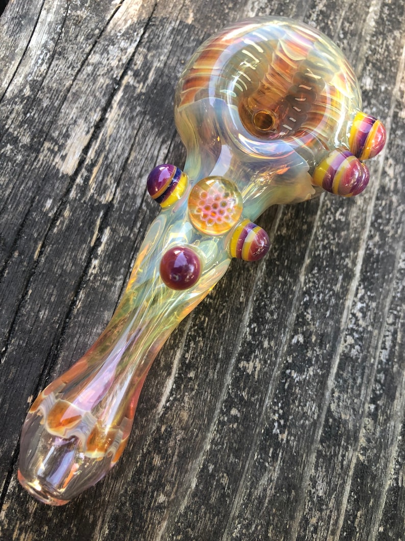 HONEYCOMB Glass pipes.HONEYCOMB with purple and yellow highlights. Fumed with silver and gold, color changing. Awesome piece image 1