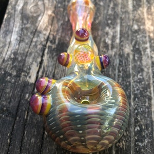 HONEYCOMB Glass pipes.HONEYCOMB with purple and yellow highlights. Fumed with silver and gold, color changing. Awesome piece image 6