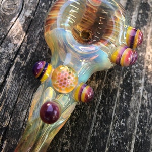 HONEYCOMB Glass pipes.HONEYCOMB with purple and yellow highlights. Fumed with silver and gold, color changing. Awesome piece image 2