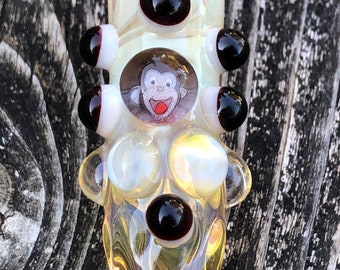 C. George Glass pipes chillum fumed one hitter.  Hand blown C. George Millie with white and red Elvis highlights. Color changing.