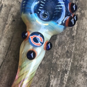 Chi cago glass pipes. Chi cago millie with blue, white and orange highlights. Fumed with silver and gold, color changing. Awesome