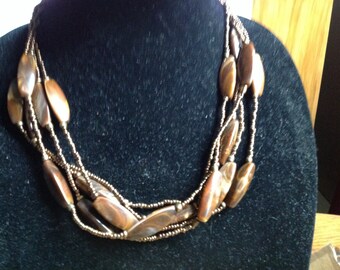 Vintage Four Strings Of Small Bronze Beads / Oblong Multi Color Cream,Tan, Brown With Goldtone Clasp And Chain