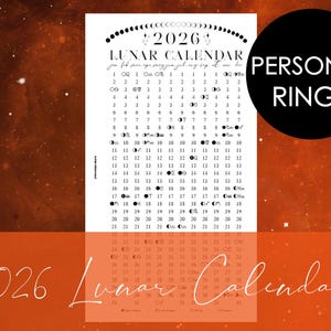 May include: A white 2026 lunar calendar with moon phase illustrations. The calendar has a black circle with the words "PERSONAL RINGS". The background is a gradient of orange and brown with a starry effect.
