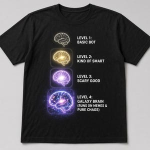 May include: A black short-sleeved t-shirt featuring a vertical graphic of four brain illustrations with text: LEVEL 1: BASIC BOT, LEVEL 2: KIND OF SMART, LEVEL 3: SCARY GOOD, and LEVEL 4: GALAXY BRAIN (RUNS ON MEMES & PURE CHAOS) in white lettering.