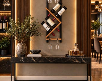 May include: A wall-mounted wine rack featuring a black metal frame with light wood accents, holding four wine bottles at an angle and four hanging wine glasses. The rack is positioned above a black marble console table with a metal base.