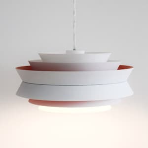 May include: A white pendant light with multiple layers, each with a subtle pink hue. The light is suspended from the ceiling by a white cord.