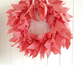 Red and white ribbon wreath