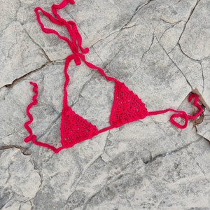 May include: A set of three ceramic mugs with a speckled, matte finish. The mugs are in shades of cream, light brown, and dark brown. Each mug has a rounded handle and a simple, minimalist design.