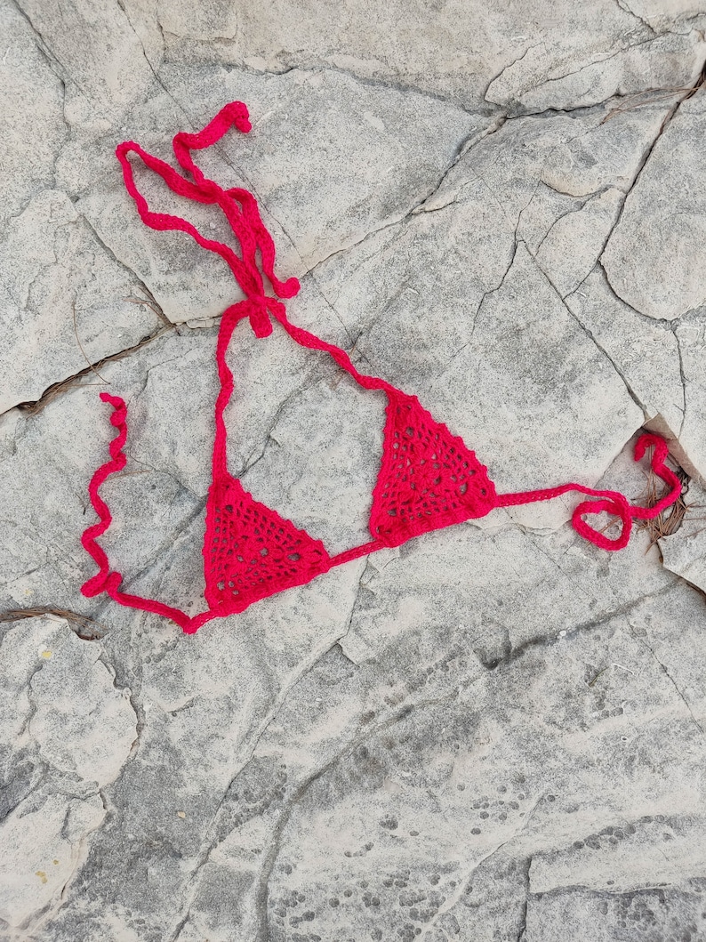 May include: A set of three ceramic mugs with a speckled, matte finish. The mugs are in shades of cream, light brown, and dark brown. Each mug has a rounded handle and a simple, minimalist design.