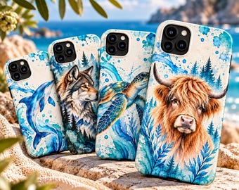 May include: Four smartphone cases featuring watercolor-style illustrations. The designs include a blue dolphin, a grey wolf in a forest, a sea turtle, and a brown Highland cow, all set against blue and white splashes and forest motifs.