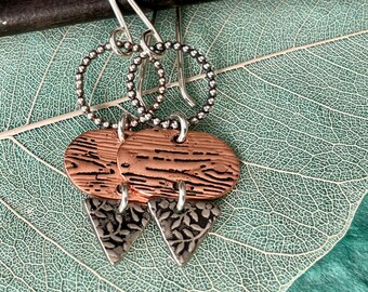 Handmade copper and silver earrings with textures of bark and leaves