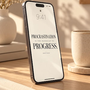 May include: A smartphone with a light-colored screen displaying the black text: Procrastination is the handicap to progress. Rena Rose. The device has a dark frame and a notch at the top, showing a time of 9:41 and standard status icons.