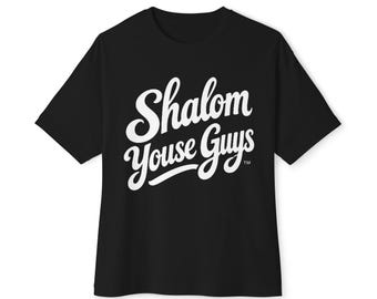 May include: A black short-sleeved t-shirt featuring the white text Shalom Youse Guys printed in a cursive script font across the chest, with a small trademark symbol located at the end of the second line of text.