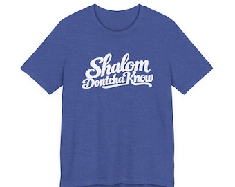 May include: A heathered royal blue short-sleeve t-shirt featuring the white screen-printed text Shalom Dontcha Know in a cursive script font centered on the chest. The garment has a classic crew neckline and a standard fit.
