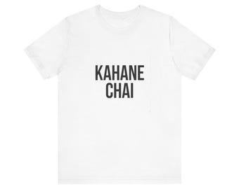 May include: A white short-sleeved t-shirt featuring the text KAHANE CHAI printed in bold black capital letters across the center of the chest. The garment has a crew neckline and a standard fit, constructed from a plain white fabric.