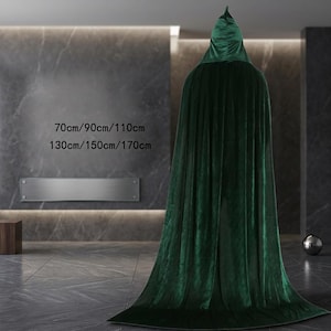 May include: A floor-length dark green velvet hooded cloak. The text on the image displays the available lengths as 70cm, 90cm, 110cm, 130cm, 150cm, and 170cm. The garment features a pointed hood and a full, flowing silhouette.