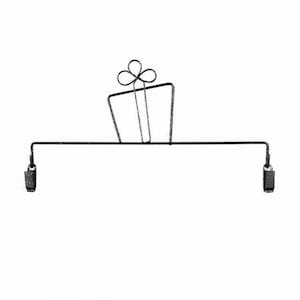 May include: Black metal gift card holder with two clips. The holder is shaped like a gift box with a bow on top.