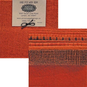 May include: An assortment of hand-dyed wool fabric in shades of orange and black. The image includes a tag with the text "HAND DYED WOOL FROM PRIMITIVE GATHERINGS" and contact information. The fabrics have various textures and patterns.