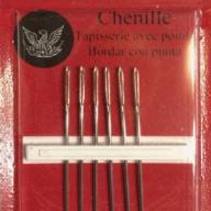 May include: A package of 6 chenille needles, size 24, by Richard Hemming & Son. The needles are silver and are packaged in a red and white cardboard box with a white label that says "Chenille" and "laperie, ovce pound Hordar con p".