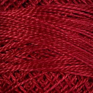 May include: A deep red embroidery thread featuring a multi-ply twisted construction. The fibers exhibit a subtle sheen and are tightly wound together, creating a dense, textured surface with visible diagonal lines throughout the entire composition.