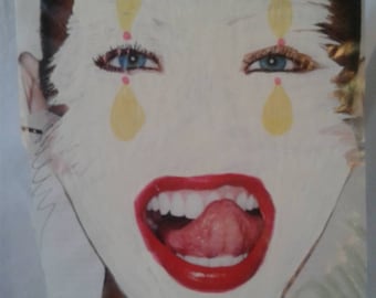 Direct Painting of a Clown, white mask on a funny face.