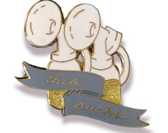 This Sucks, mother pumping breastmilk/breastfeeding enamel pin. Copper or gold.