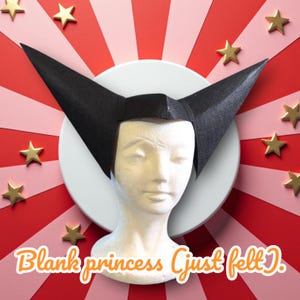 May include: A black felt headpiece with tall, pointed ears, displayed on a white mannequin head. The headpiece is set against a background of red and pink stripes, with gold star accents and the text "Blank princess (just felt)."
