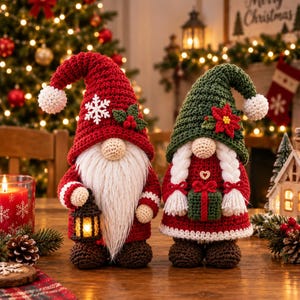 May include: Two crocheted gnome figurines. The left gnome wears a red hat with a white snowflake and holly, holding a small lantern. The right gnome wears a green hat with a poinsettia, white braided hair, and holds a small green gift box.