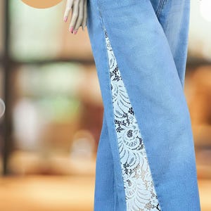Handmade lace panel jeans transforming original denim into custom flare pants, artistic upcycled fashion piece with boho aesthetic
