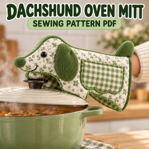 May include: A dachshund-shaped oven mitt featuring a white fabric with a green floral print, green corduroy ears, a nose, and a tail. The mitt includes a green and white gingham pocket and text reading DACHSHUND OVEN MITT SEWING PATTERN PDF.