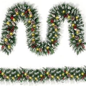 May include: A festive artificial Christmas garland featuring green pine needles with white flocked tips, decorated with brown pinecones, clusters of red berries, and integrated warm yellow LED string lights arranged in a draped pattern.