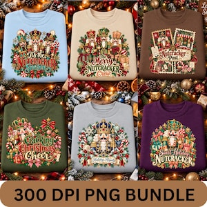 May include: A collection of six crewneck sweatshirts in light blue, beige, brown, olive green, grey, and purple, each featuring a detailed graphic print of nutcracker figures, Christmas trees, wrapped gifts, and festive holiday text.