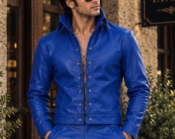 May include: A vibrant blue leather jacket with a high collar and a lace-up front closure, paired with matching blue leather trousers. The jacket features long sleeves and a fitted cut, while the trousers have a straight-leg design.