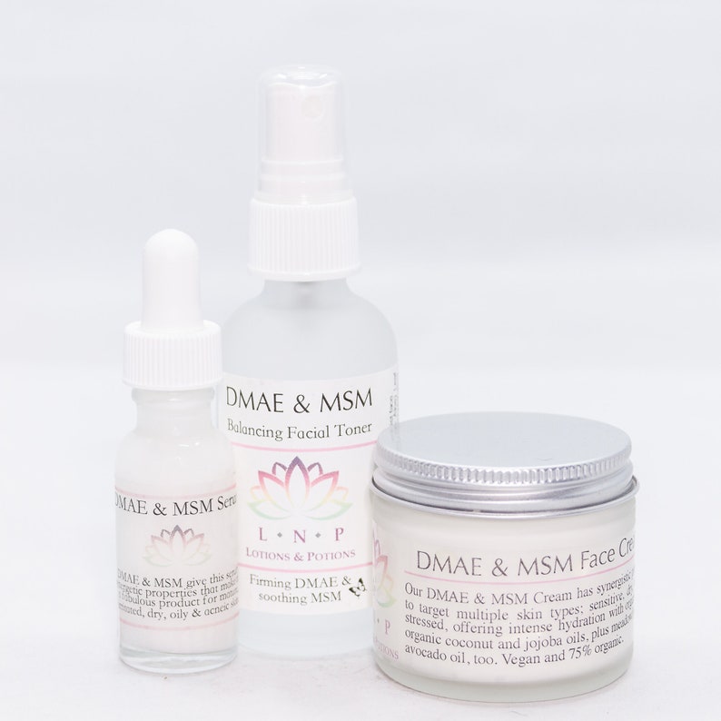 May include: Three white bottles of skincare products with silver lids. The bottles are labeled "DMAE & MSM" and "L.N.P. LOTIONS & POTIONS". The products are a serum, toner, and face cream.