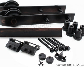 May include: Black metal sliding barn door hardware kit with two rollers, two track pieces, two stops, two floor guides, and mounting screws.  Copyright 2016 (c) - I.A. Decor
