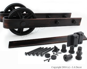 May include: Black metal sliding barn door hardware kit with two wheels, a track, and mounting hardware. The kit includes screws, brackets, and stoppers.