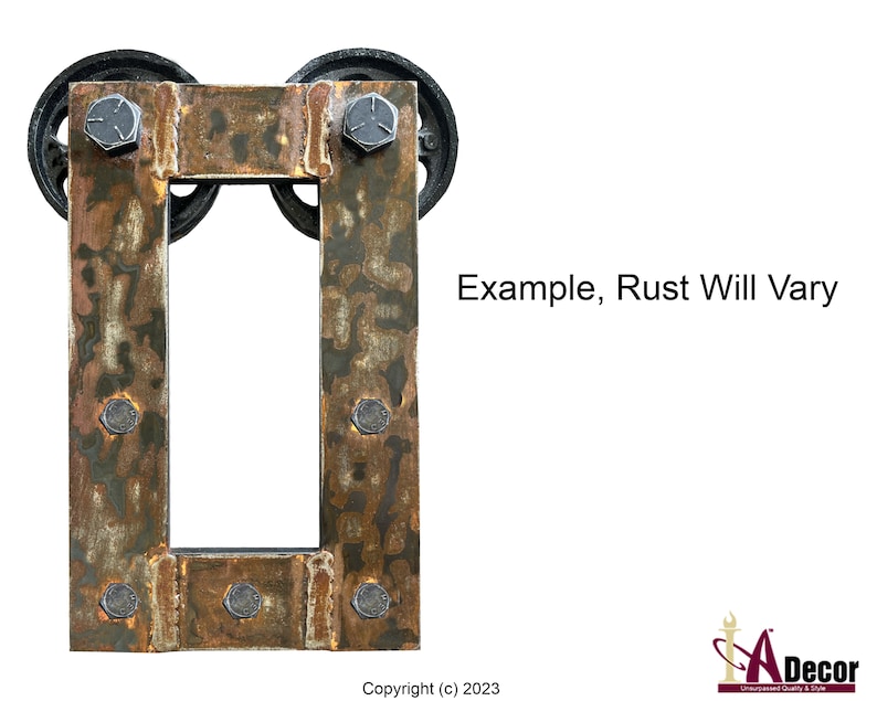 May include: A rectangular metal frame with a rusted finish, featuring two black circular wheels at the top and six silver-colored bolts secured along the sides. The text "Example, Rust Will Vary" is printed to the right of the frame.