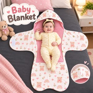 May include: A hooded baby blanket featuring a white fabric with a repeating pattern of teddy bears, rainbows, and pink flowers. The interior is lined with solid pink fabric. The blanket has a hood and side flaps with hook-and-loop closures.