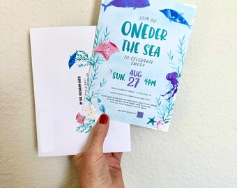 May include: A blue and green watercolour invitation with the text "Join us Oneder the Sea to celebrate Emery Sun. Aug. 27 4PM 1005 Elizabeth Creek Little Elm, TX" and a seahorse, jellyfish, and whale illustration.
