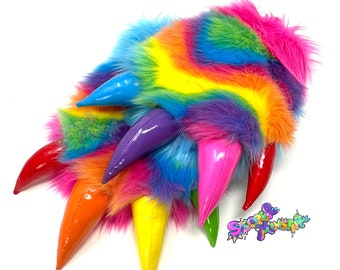 May include: Rainbow colored faux fur paw with six shiny claws in red, orange, yellow, green, purple, and pink.
