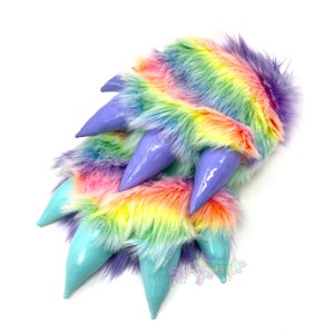 May include: Rainbow colored fuzzy slippers with purple and turquoise claws.