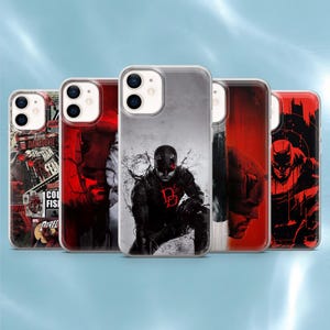 May include: Five clear smartphone cases featuring various Daredevil comic book illustrations and character graphics. The designs include red and black color schemes, a collage of comic panels, and a central figure of the hero in a black suit.