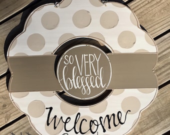 neutral wreath door hanger with polka dots and hand lettering interchangeable