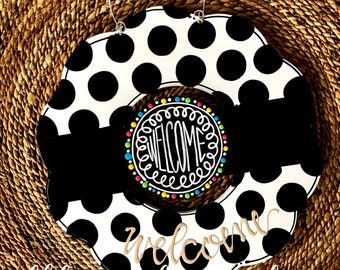 Black and white wreath door hanger with polka dots and hand lettering interchangeable
