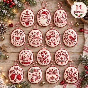 May include: A set of 14 round, white felt Christmas ornaments featuring red embroidered designs including a tree, Santa, a house, a reindeer, a sleigh, a child, a bird, a snow globe, a candy cane, a bell, mittens, a stocking, a mug, and a snowflake.