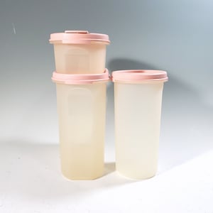 Vintage Tupperware storage containers with pink lids, modular mates