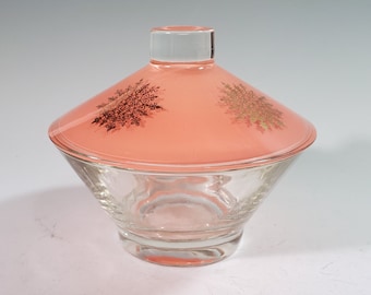 Hazel Atlas glass candy or vanity jar, coral pink lid with gold snowflakes, clear base