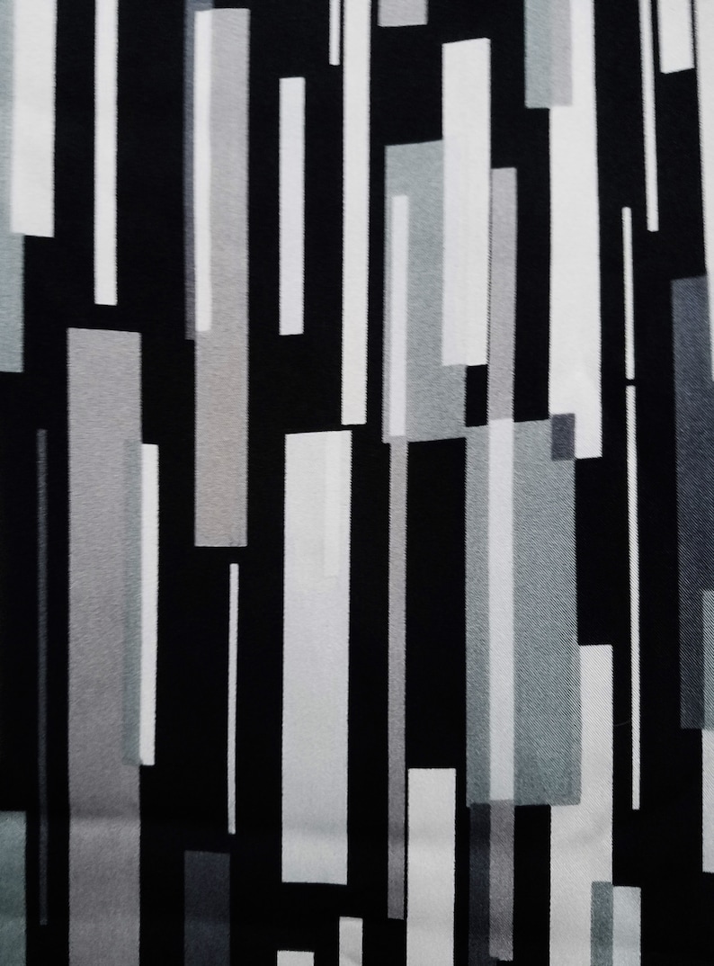 May include: Abstract geometric pattern fabric with vertical stripes in black, white, and gray.