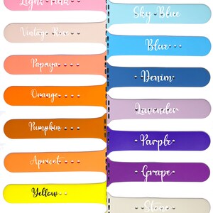 May include: A set of 16 Apple Watch bands in various colors, with each band labeled with a color name. The colors include red, rose red, red wine, light pink, vintage rose, papaya, orange, pumpkin, apricot, yellow, pale yellow, white, black, lime, turquoise, mint, sky blue, blue, denim, lavender, purple, grape, stone, concrete, coco, and dark olive.