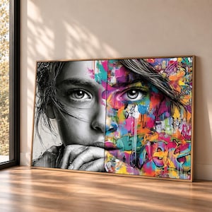 May include: A rectangular wall art print featuring a split-face portrait. The left side is rendered in black and white, whilst the right side displays vibrant, multi-coloured graffiti-style paint splatters, drips, and abstract patterns.